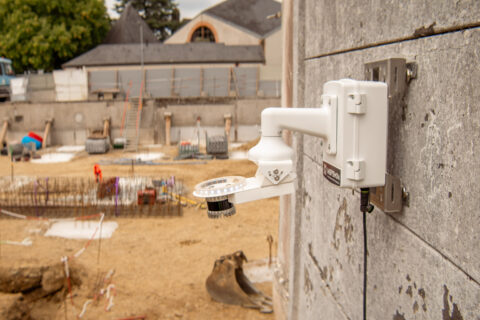 Inspemon analysis machine mounted on a wall for real-time monitoring and data collection.